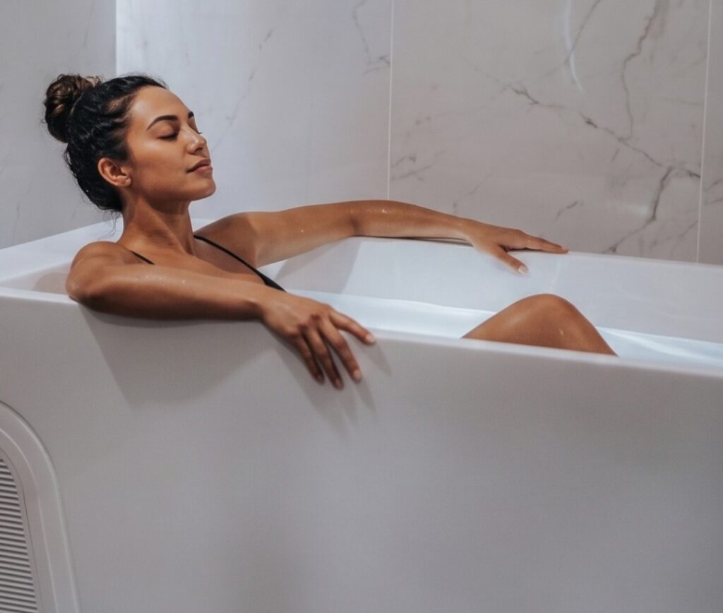 woman relaxing in cold plunge.